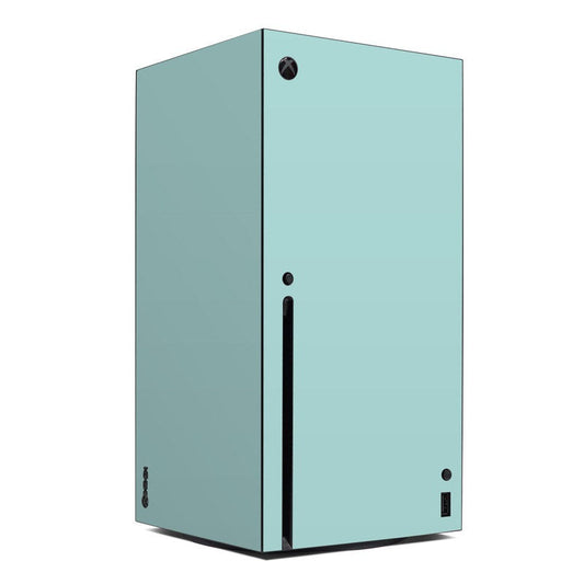 Mint-colored Xbox Series X skin with black Xbox logo and vertical port strip
