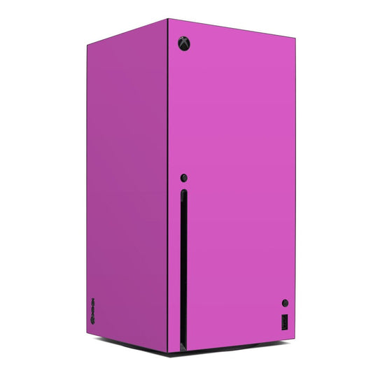 Vibrant pink Xbox Series X console skin with black vents and Xbox emblem