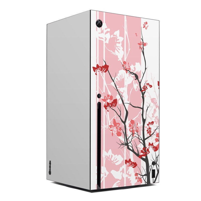 Xbox Series X skin with pink and red blossom tree branch graphics on pale base