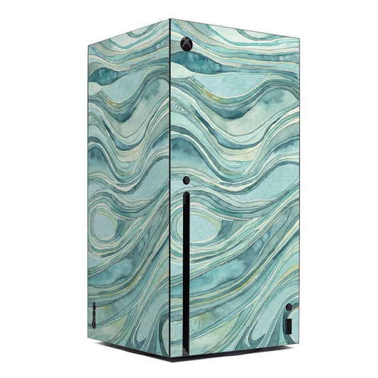 Xbox Series X console skin with teal wave pattern and black logo cutouts