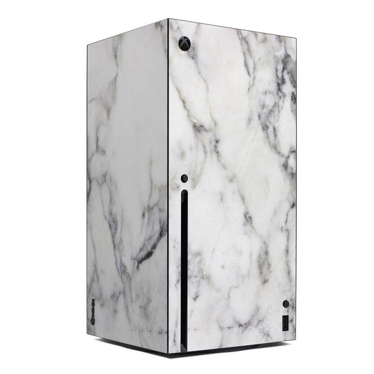Xbox Series X marble vinyl skin, white with gray veining, visible buttons and ports.