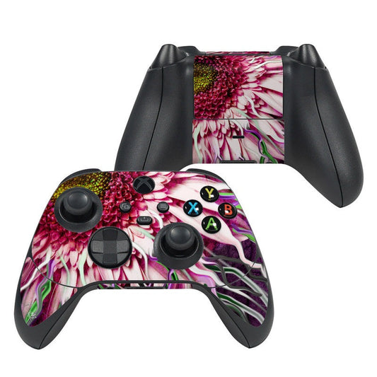 Game controller skin with pink and white daisy floral design and colored button layout