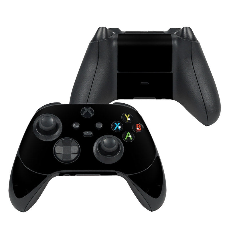 Black Xbox Series X controller skin with thumbstick and button cutouts visible