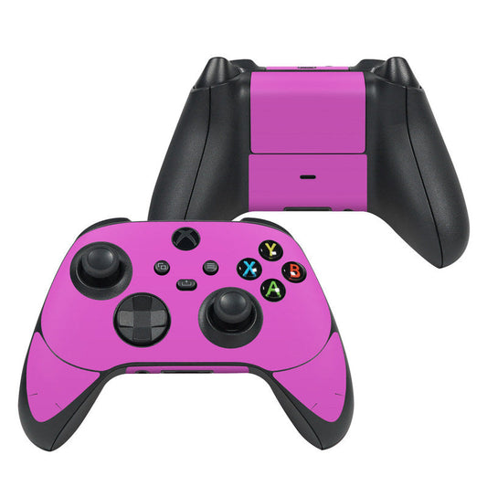 Vibrant pink Xbox Series X controller skin with button icons and cutouts
