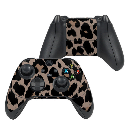 Xbox Series X controller skin with black and tan camo pattern, button icons on face