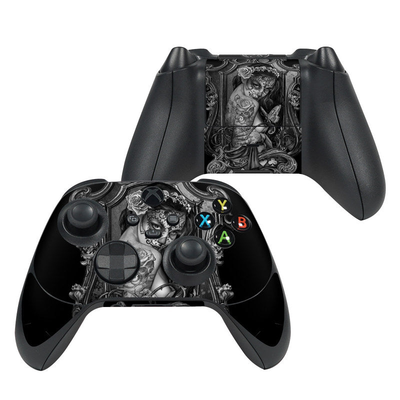 Black Xbox Series X controller skin with widow illustration and colored ABXY buttons