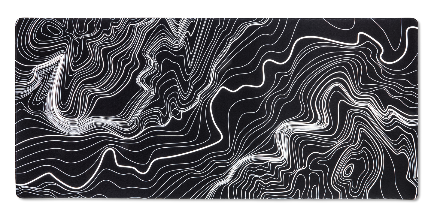 Black desk mat with white contour line topographic pattern and rounded edges